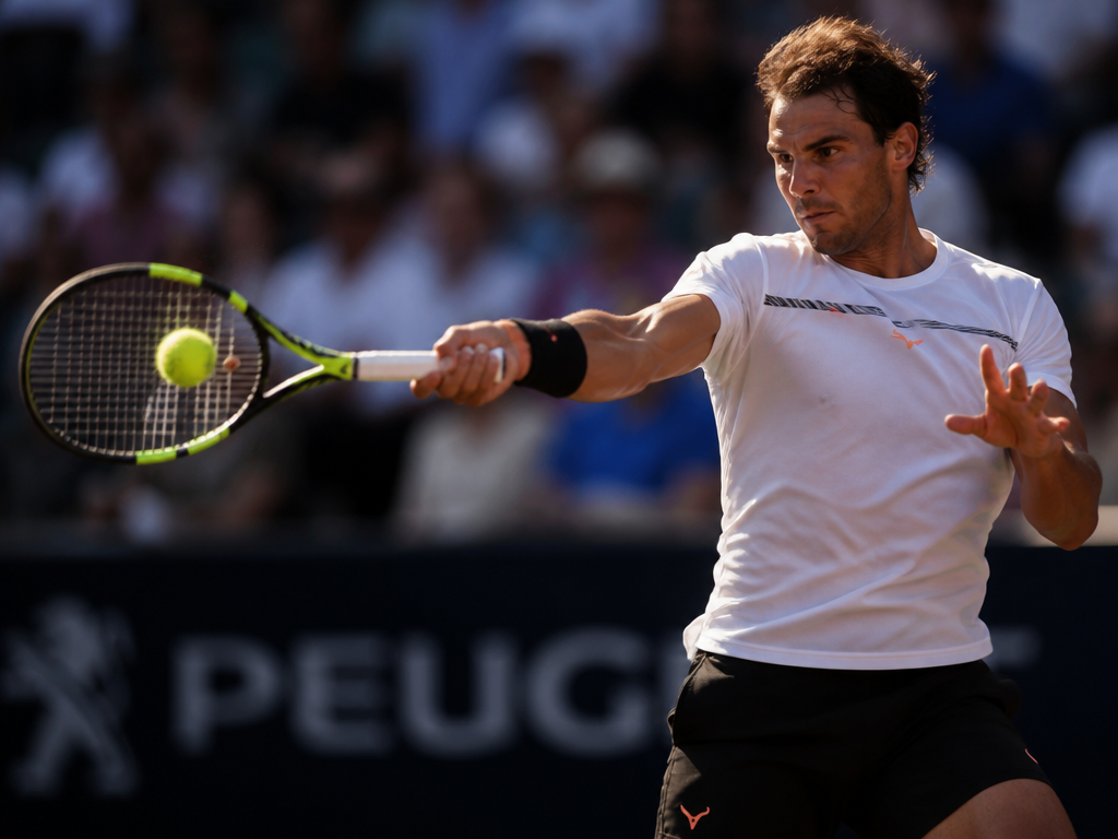 Photorealistic action shot of a lone tennis player captured at the precise moment of…